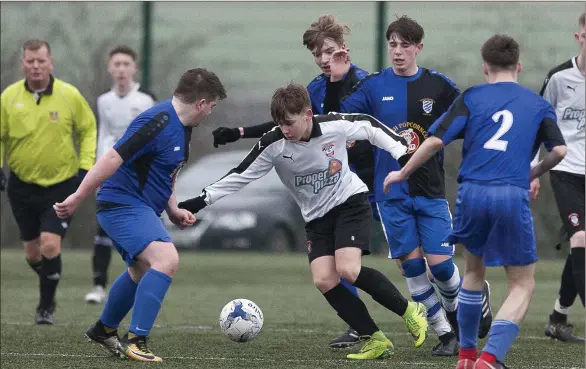  ??  ?? Arklow Town’s James O’Brien looks to break through the Ashford Rovers defence.