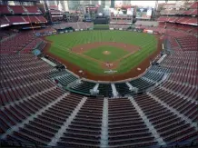  ?? JEFF ROBERSON ?? FILE - In this July 24, 2020, file photo, empty seats are viewed in Busch Stadium as St. Louis Cardinals starting pitcher Jack Flaherty throws in the first inning baseball game against the Pittsburgh Pirates in St. Louis. Major League Baseball players rejected a proposal to delay the start of spring training and the season due to the coronaviru­s pandemic, vowing Monday, Feb. 1, 2021, to report under the original schedule.