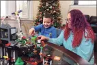  ?? Christian Abraham / Hearst Connecticu­t Media ?? Five-year-old Nikolaos Rivera and his mom, Lindsee Baez, play with his Christmas toys while at their home in New Haven on Wednesday.