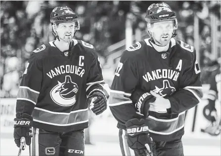  ?? CANADIAN PRESS FILE PHOTO ?? Vancouver Canucks’ Henrik Sedin, left, and his twin brother, Daniel, have announced this will be their last season in the National Hockey League.