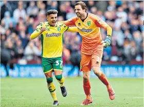  ??  ?? Back line: Max Aarons (left) and Tim Krul will aim to make Norwich tougher to score against