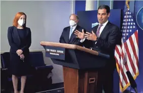  ?? EVAN VUCCI/AP ?? White House press secretary Jen Psaki and Detroit mayor Mike Duggan listen as Miami Mayor Francis Suarez speaks during a news briefing at the White House on Feb. 12.