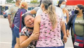  ?? Photo / AP ?? Relatives of inmates cry outside the Centro de Privacio´n de Libertad Zona 8 prison where riots broke out in Guayaquil, Ecuador.