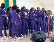  ??  ?? Members of the grade-10 student cohort at the Green Pond High School in Montego Bay present a musical tribute during the funeral for slain 15-year-old Green Pond High student Shineka Gray.