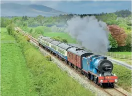  ?? ALISTAIR CAMPBELL ?? Left: V Class 4-4-0 No. 85 Merlin passes Rathcoole (County Cork) heading for Mallow and Cork with the 09.00 ‘Emerald Isle Explorer’ from Killarney on May 9.
The train had been shortened by two coaches for the stiff climb out of Cork on the return leg.