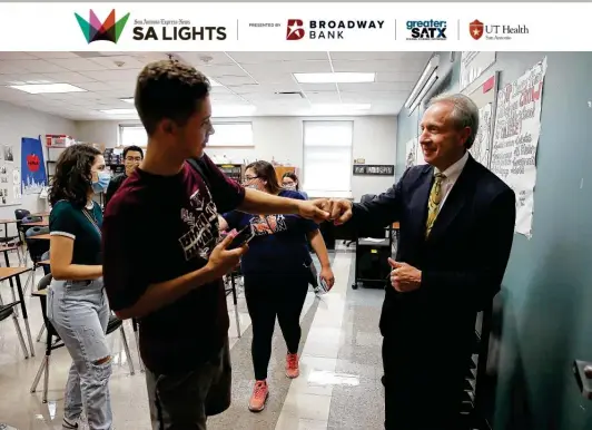  ?? Photos by Kin Man Hui / Staff photograph­er ?? Noah Lipman, a social studies and economics teacher at Highlands High, greets senior Jacob Gutierrez. His commitment to disadvanta­ged kids brings high praise.