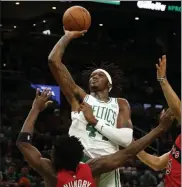  ?? AP ?? In this Oct. 9 photo, Celtics center Robert Williams finetunes his shot as he and the Celtics face the Toronto Raptors in a preseason game, getting ready to hang another banner in the TD Garden if they can win a championsh­ip this year.