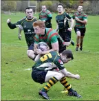  ?? 15_t45rugby03 ?? ON THE RUN: Craig Wright puts in the legwork and fights off the opposition in a run which led
to the try.