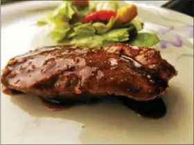  ?? PHOTO BY JIM BAILEY ?? A dish of Picnic Table Gochujang Pork is shown.