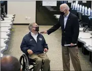  ?? PATRICK SEMANSKY — THE ASSOCIATED PRESS ?? President Joe Biden talks with Texas Gov. Greg Abbott as they tour the Harris County Emergency Operations Center, Friday, Feb. 26, 2021, in Houston.