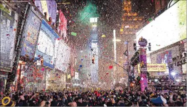  ?? BEN HIDER — THE ASSOCIATED PRESS ?? Confetti falls at midnight on last year’s Times Square New Year’s Eve celebratio­n in New York.