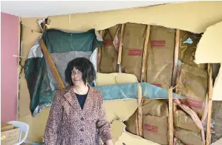  ?? PHOTOS BY FORD TURNER/THE MORNING CALL ?? Sharon Thomas, former mayor of Pottstown, shows where the May 26 explosion of a duplex next door to her Butler Avenue home caved in the living room wall. Thomas smelled gas in the area in the years before the explosion.