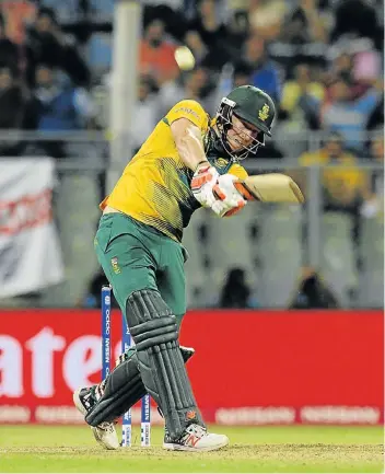  ??  ?? BIG HITTER: South Africa batsman David Miller hits out during his unbeaten innings of 28 against England in their clash in the World Twenty20 tournament in India yesterday PHOTOGRAPH: GETTY IMAGES