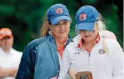  ?? [PHOTO BY BRYAN TERRY, THE OKLAHOMAN] ?? Auburn coach Melissa Luellen, left, talks with golfer Michaela Owen on Sunday at Karsten Creek in Stillwater.