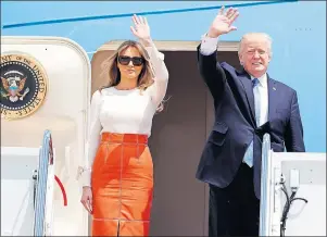  ?? AP PHOTO ?? President Donald Trump and first lady Melania Trump, wave as they board Air Force One at Andrews Air Force Base, Md., Friday, prior to his departure on his first overseas trip.