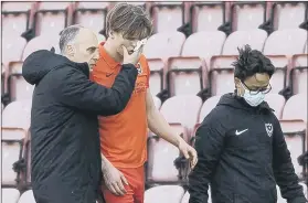  ??  ?? WOUNDED WARRIOR Blues defender Sean Raggett trudges off the pitch