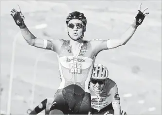  ?? DANIEL DAL ZENNARO THE ASSOCIATED PRESS ?? Belgium's Tim Wellens celebrates as he crosses the finish line to win the fourth stage of the Giro d'Italia cycling race from Catania to Caltagiron­e on Tuesday.