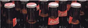  ?? LUKE SHARETT, BLOOMBERG ?? With U.S. sales declining, Anheuser-Busch InBev, makers of Budweiser, is looking to expand globally, especially in Africa, where SABMiller has a big presence.