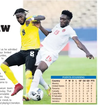  ?? GLADSTONE TAYLOR PHOTOS ?? Reggae Boyz defender Oneil Fisher (left) in a battle with Canada’s top player Alphonso Davies during yesterday’s Concacaf World Cup qualifying match at the National Stadium.