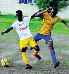  ?? KENYON HEMANS ?? Northern Technical High School’s Leechawn McIntosh (left) tries to get away from Penwood High School’s Shane Reynolds during their ISSA/Digicel Manning Cup match at Cling Cling Oval in Olympic Gardens, St Andrew, on Tuesday.