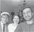  ??  ?? Mohammad Hussain, right, with roommates Kirsten Paula and Ahmad Farhat in Ottawa, Ontario.