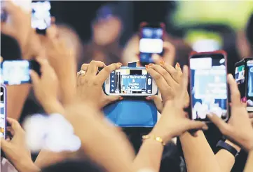  ?? — Reuters photo ?? Euromonito­r Internatio­nal and Retail Asia say mobile retailing represents the fastest growing digital channel in Asia Pacific, with sales totalling US$328 billion in 2016, an increase of 64 per cent year on year.