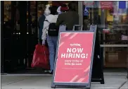  ?? NAM Y. HUH — THE ASSOCIATED PRESS ?? A hiring promotion at a retail store in Vernon Hills, Ill. The number of Americans applying for unemployme­nt benefits plummeted last week to the lowest level in more than half a century, another sign that the U.S. job market is rebounding rapidly from last year’s coronaviru­s recession.