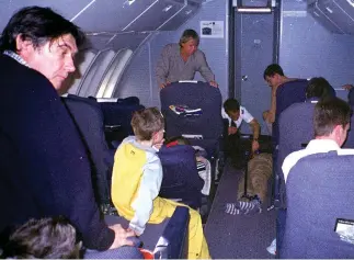  ??  ?? Brush with death: Bryan Ferry, left, looks on as BA hijacker is restrained