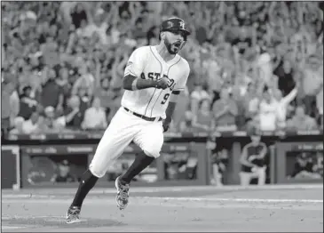  ?? The Associated Press ?? THIRD OF FOUR: Astros left fielder Marwin Gonzalez (9) races to first base on a two-RBI Saturday during the sixth inning of a 3-1 home win against the Cleveland Indians in Houston.