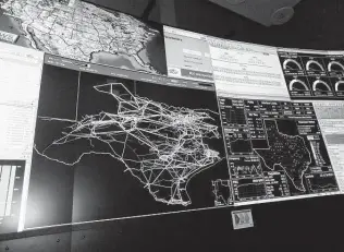  ?? Ryan Holeywell / Staff file photo ?? A map of Texas shows transmissi­on lines in the control room of the Electric Reliabilit­y Council of Texas, which operates most of the state’s power grid.