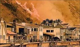  ?? WALLY SKALIJ/LOS ANGELES TIMES ?? Wildfires reached State Route 101 on Wednesday north of Ventura, threatenin­g beachfront homes. This particular fire started Monday afternoon about 30 miles inland.