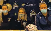 ?? COURTESY TIM FITZGERALD ?? Benicia High senior Amanda Carvalho, middle, recently signed a letter of intent to study and play soccer at Cal Maritime. Women’s coach Emily Scheese is on the left, while Carvalho’s dad, Michael, is on the right.