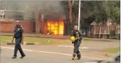  ?? PICTURE: SHAN PILLAY ?? Gates at the Malabhere residence on the UKZN Pietermari­tzburg burn today. Two of the gates at the campus’s Williem O’Brien residence were also set ablaze.