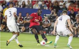  ??  ?? CARSON: Manchester United Romelu Lukaku (C) kicks the ball against Los Angeles Galaxy during the second half of a national friendly soccer game at StubHub Center on Saturday in Carson, California. Manchester United won 5-2. — AFP