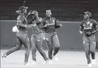  ??  ?? West Indies Women celebrate the wicket of Harmapreet Kaur. (Orlando Charles photo)