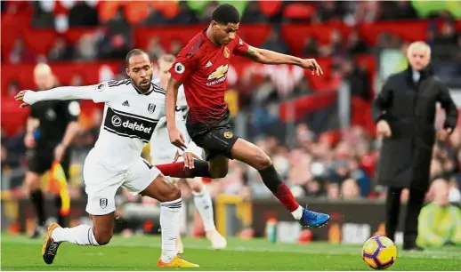  ?? — Reuters ?? Coming through: Manchester United’s Marcus Rashford (right) vying for the ball with Fulham’s Denis Odoi in the Premier League match at Old Trafford on Saturday.