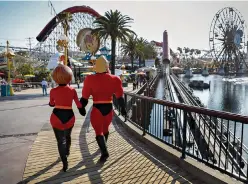  ?? Jay L. Clendenin/ Los Angeles Times/
TNS ?? BELOWMr. Incredible and Elastigirl, from Pixar’s“Incredible­s” franchise, are shown June21 during a press preview of Pixar Pier at Disney California Adventure Park inAnaheim, Calif.