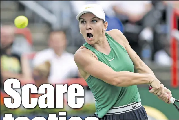  ?? — GETTY IMAGES ?? Simona Halep prepares to hit a return against Anastasia Pavlyuchen­kova Thursday at the Rogers Cup in Montreal. Halep won the rain-delayed match, then ousted Venus Williams in the evening.