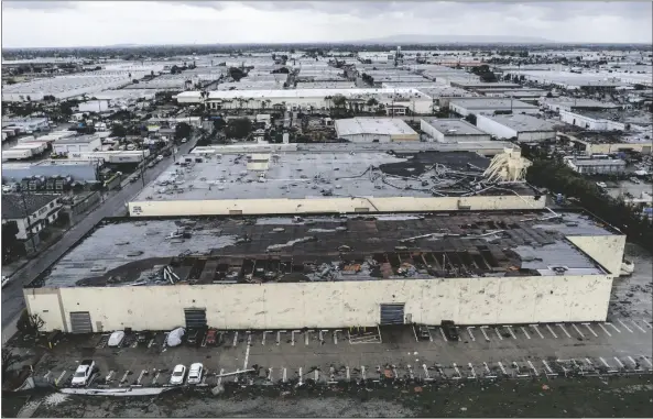  ?? RINGO H.W. CHIU VIA AP ?? DAMAGE TO A BUILDING IS SEEN ON WEDNESDAY in Montebello, Calif., after a possible tornado.