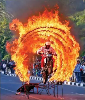  ?? REUTERS ?? A member from Indian Army’s Military Police performs a daredevil stunt during a military literature festival in Chandigarh on Thursday.