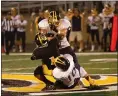  ?? BARRY BOOHER — FOR THE NEWS-HERALD ?? Kirtland’s Mike Alfieri, top, and Louie Loncar combine to bring down Riverside quarterbac­k Dom Lulow on Sept. 6, 2019 at Riverside.