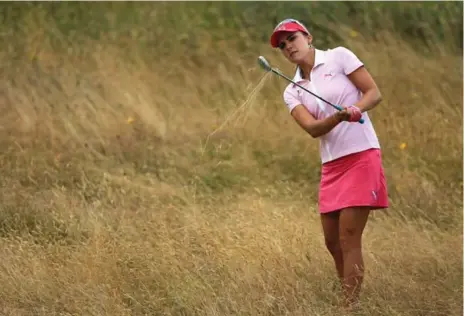  ?? DAVID CANNON/GETTY IMAGES ?? Lexi Thompson plays at the 2014 Women’s British Open at Royal Birkdale, more than 100 years after the course’s first major tournament for women.