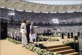  ?? PHOTOS BY ALEX BRANDON — THE ASSOCIATED PRESS ?? President Donald Trump, first lady Melania Trump and Indian Prime Minister Narendra Modi arrive for a “Namaste Trump” event on Monday in Ahmedabad, India.