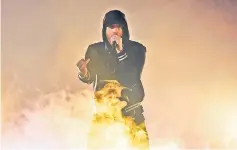  ??  ?? Eminem performs at the iHeartRadi­o Music Awards Sunday.