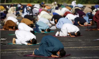  ?? Photograph: Joshua Lott/Getty Images ?? The Muslim Pro app has been downloaded by close to 100 million people and is used to aid Muslims in planning prayer, finding local halal food and fasting during the holy month of Ramadan.