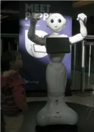  ?? THE ASSOCIATED PRESS ?? Pepper the robot makes an appearance at Westfield Mall in San Francisco on Thursday. While merrily chirping, dancing and posing for selfies, Pepper looks like another expensive toy in the San Francisco mall where it will be entertaini­ng shoppers...