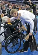  ?? THE ASSOCIATED PRESS ?? Sister Jean Dolores Schmidt, left, greets Loyola-Chicago coach Porter Moser as he walks off the court after the team’s firstround win over Miami in Dallas.