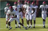  ?? VASHA HUNT — ALABAMA MEDIA GROUP ?? In this file photo, Alabama wide receiver Cam Sims (17) works through drills during a spring football practice, in Tuscaloosa, Ala. The NCAA has voted to allow high school football players to sign with colleges as early as December, make early official...