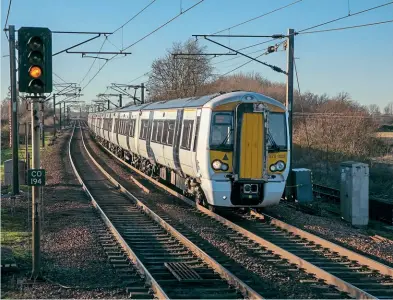 ?? Keith Partlow ?? As reported in the last issue of Railways Illustrate­d, Greater Anglia has started taking its Class 379 EMUS out of service and placing them into warm store. On January 13, 379002 and 379011 pass through Manningtre­e working 5A32, the 13.24 Ilford EMU Depot to Parkeston Yard, where the pair are to be stored.
