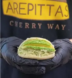  ?? Emily Matthews/Post-Gazette ?? Arepittas’ Reina Pepiada arepa, with shredded chicken.